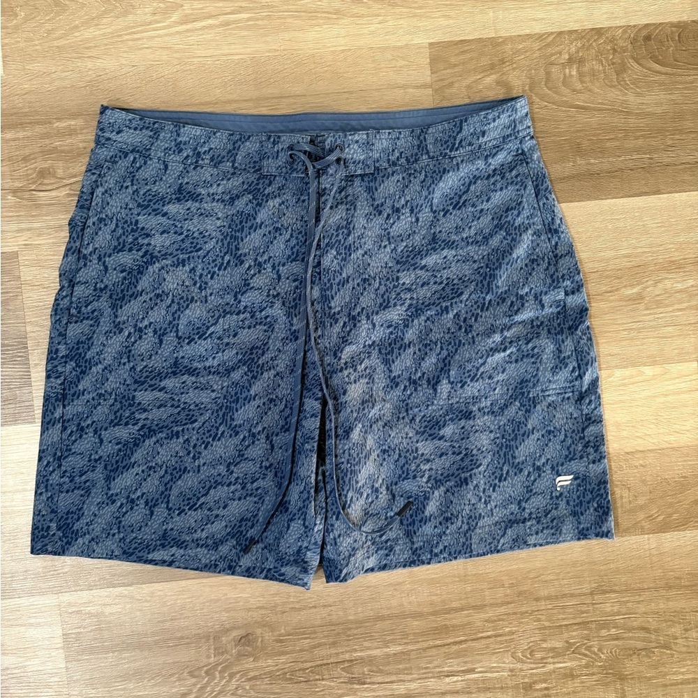 Fabletics Men’s Blue Patterned athletic performance shorts. Size Large.